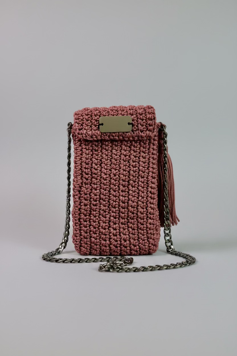 Rust colored crocheted , black lined cellphone purse with 47" chain